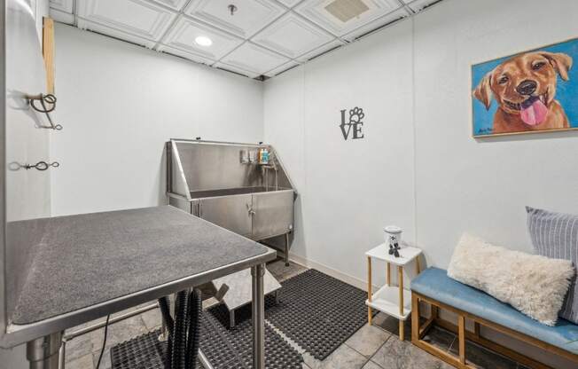 a dining room with a table and a dog painting on the wall