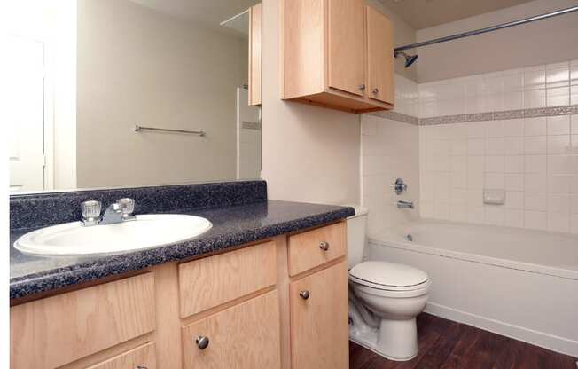 an empty bathroom with a sink toilet and bath tub