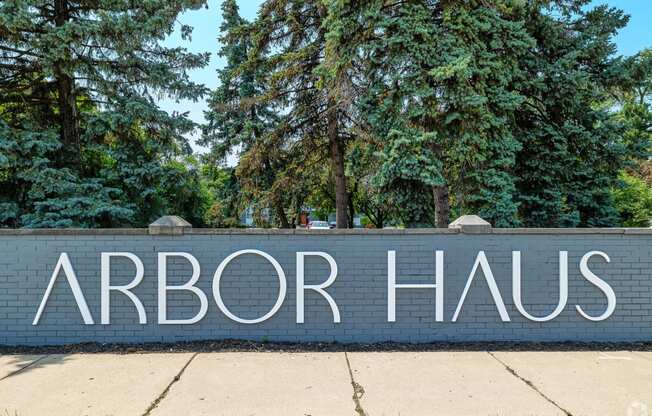 a brick wall with the words arbor haus written on it