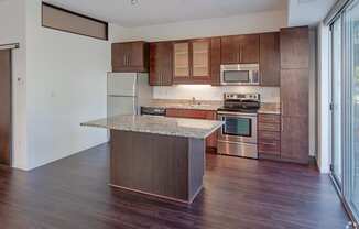 1800 Lake Kitchen with island, cherry cabinetry and stainless steel appliances