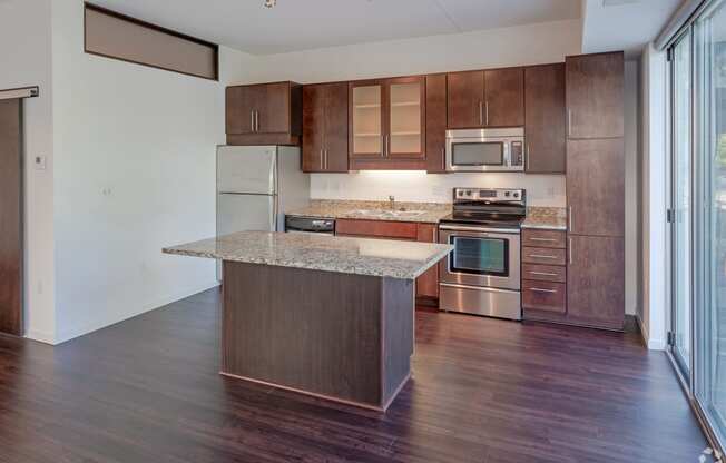 1800 Lake Kitchen with island, cherry cabinetry and stainless steel appliances