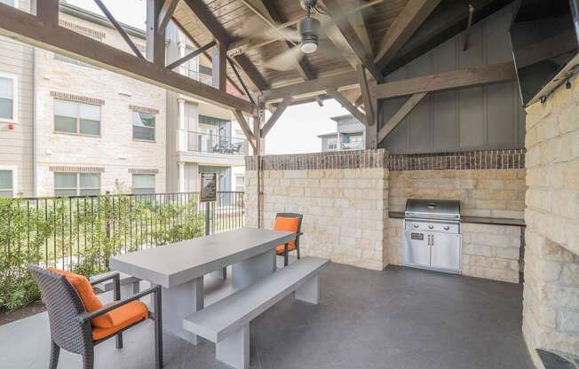 A patio with a table and chairs is shown.