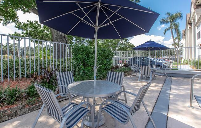 a lawn chair under an umbrella