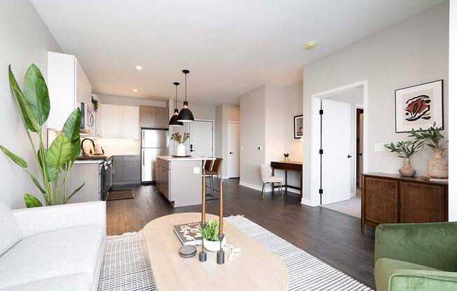 open concept living room and kitchen with stainless steel appliances at The Bohen, Luxury Apartments for Rent Minneapolis