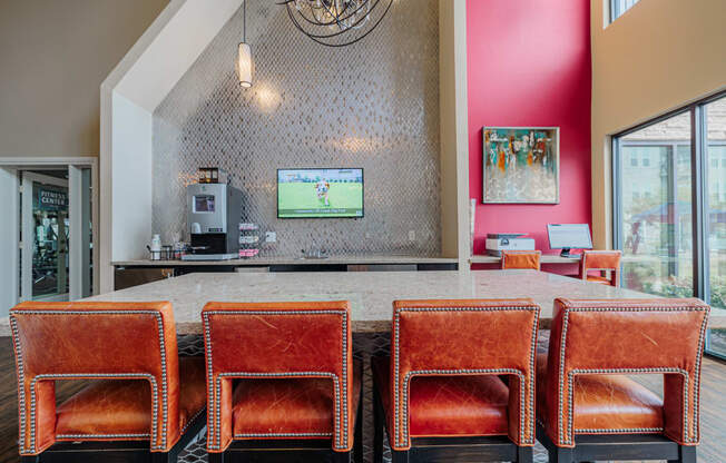 a dining room with a table and chairs and a television