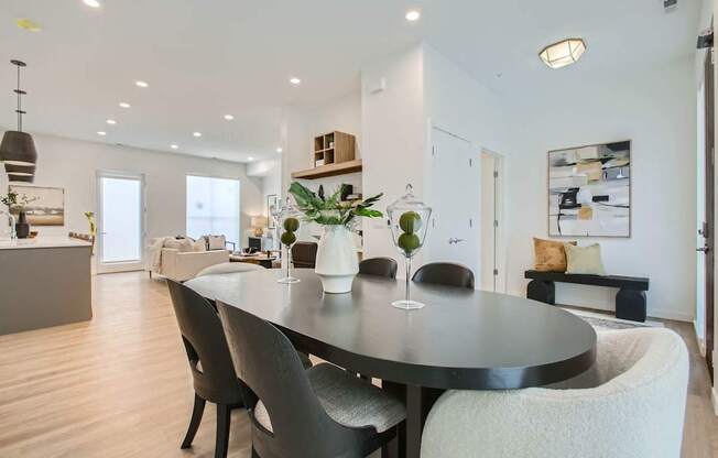 a dining room with a table and chairs