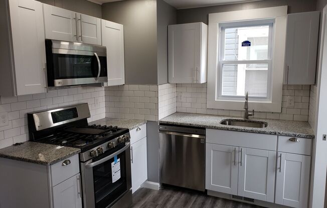 End row home with stainless appliances, washer & dryer on first floor, central A/C, small pets ok*!