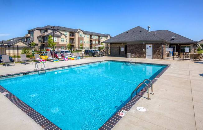 our resort style swimming pool is next to our building with our apartments in the background