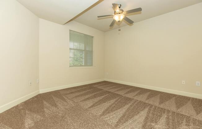 a bedroom with a bed and a mirror