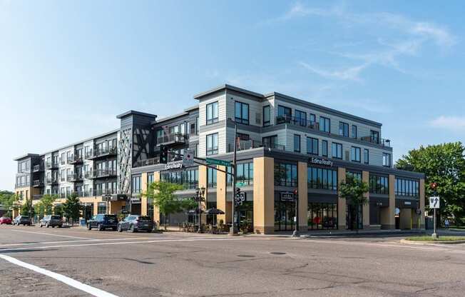 A large, modern building with a flat roof and a sign that reads