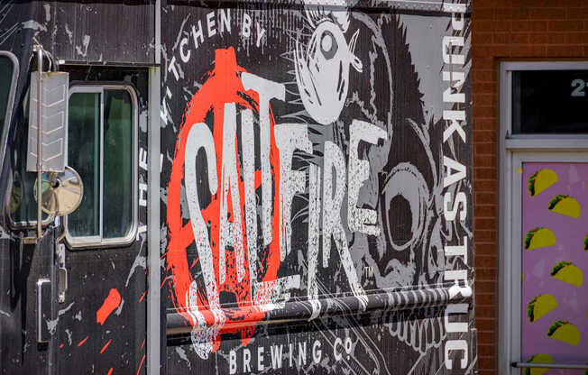 A truck with a large logo on the side that says