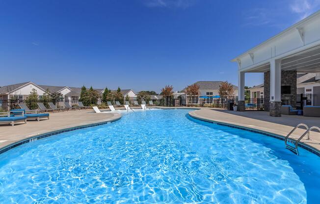 Dive Into A Shimmering Swimming Pool At Riverstone Apartments At Long Shoals In Arden, North Carolina