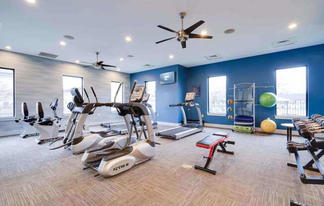 1-Bedroom Apartments In Louisville, KY - Enclave At Breckenridge - Fitness Center With Elliptical Machines, Treadmills, Yoga Balls, Workout Bench, Free Weights, Ceiling Fans, and Plenty of Windows.