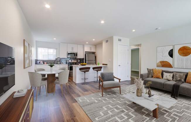 a living room with a kitchen and a dining room