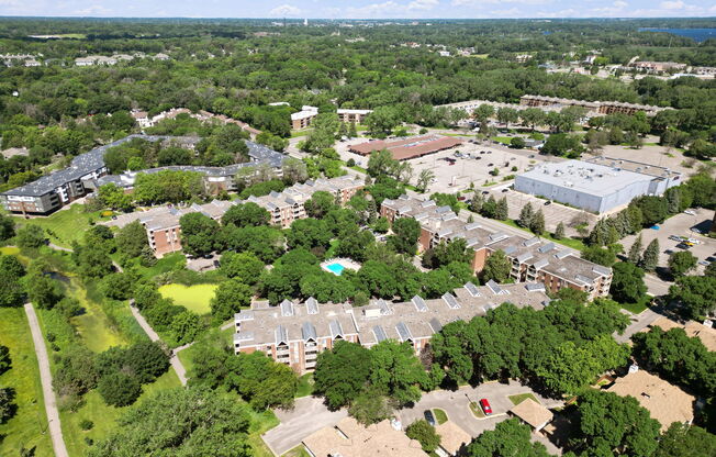 A bird's eye view of a campus with buildings and trees.