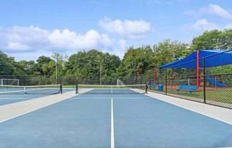 Community Pickleball Courts with Nets at Heights at Marlborough Apartments located in Marlborough, MA.