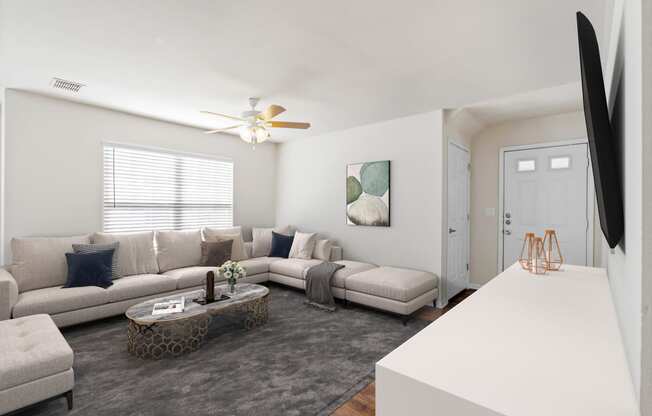 a living room with a large couch and a coffee table