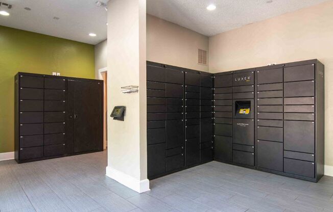 a large set of lockers in a room with a door