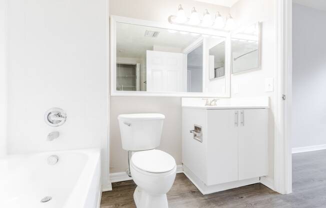 a bathroom with a white sink and toilet and a white bathtub at Heritage Bay, Florida