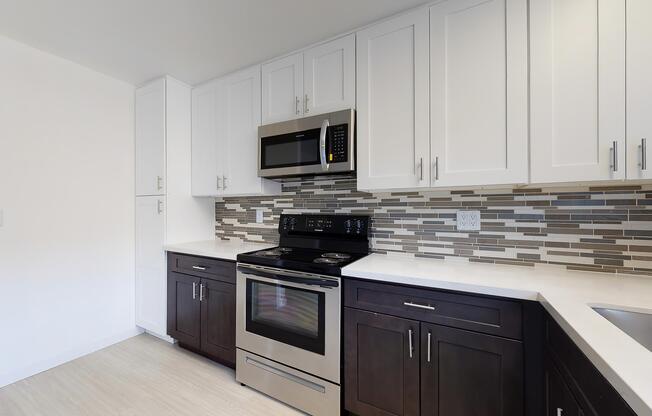 a stove top oven sitting inside of a kitchen