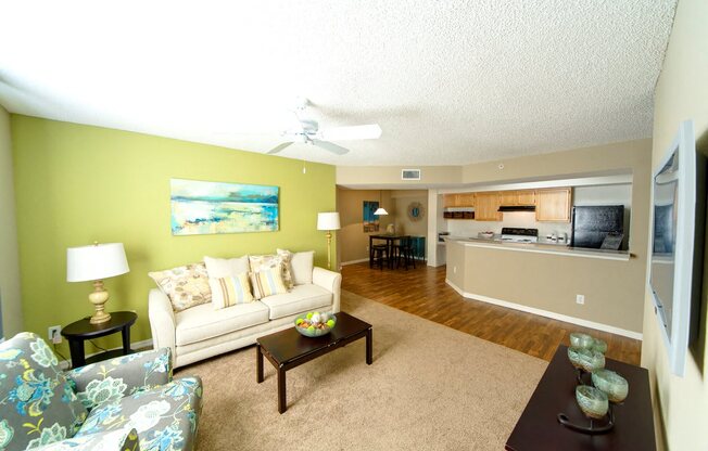 A living room with a couch, chair, and coffee table.