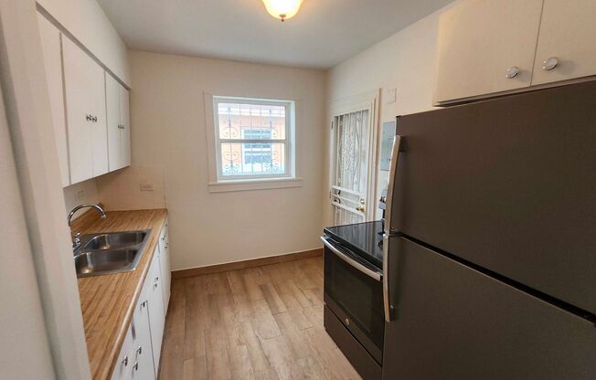 Charming 2-Bed Single-Family Home featuring Hardwood Floors & Huge Yard