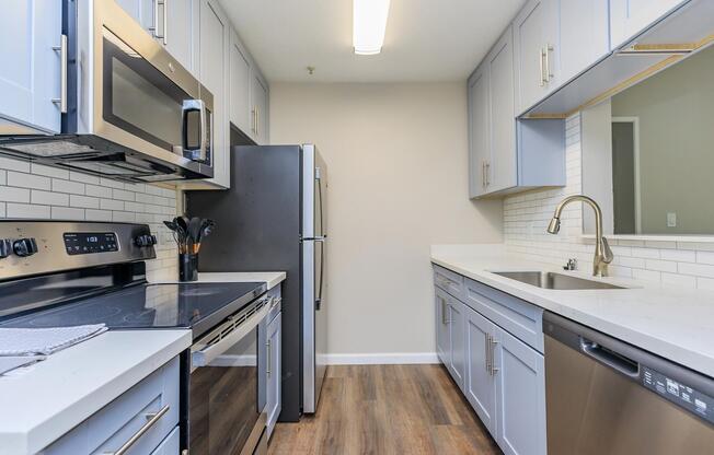 a kitchen with a stove top oven