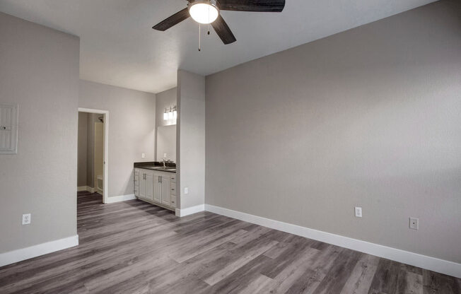 a bathroom with a sink and a ceiling fan