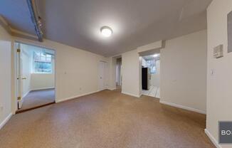 207 209 W 11 ST