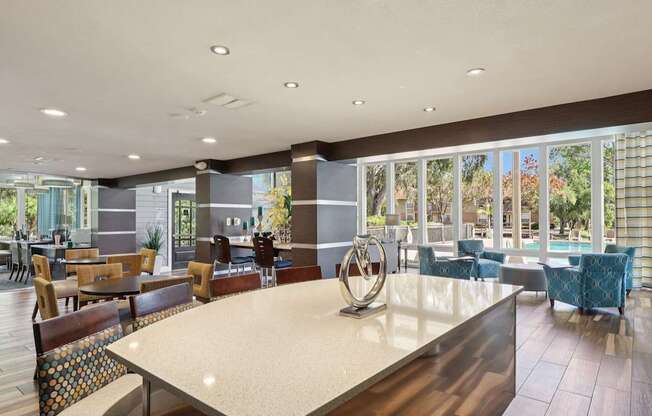 A large dining room with a long table and chairs.