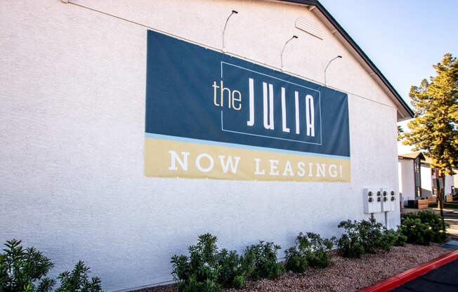 a sign on the side of a building that says the julia now leasingat The Julia, Mesa