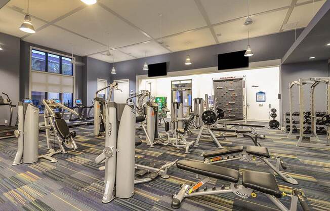 a room filled with lots of different types of exercise equipment  at Cabana Club - Galleria Club, Jacksonville, FL, 32256