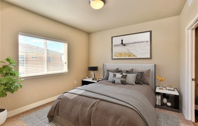 a bedroom with a large bed and a window