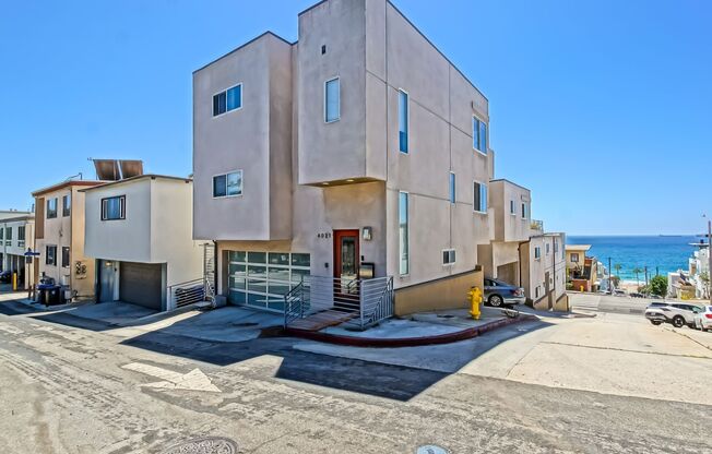 MODERN, BRIGHT & SPACIOUS, TRI-LEVEL DETACHED TOWNHOUSE W/ UNOBSTRUCTED OCEAN VIEWS, 2 BALCONIES & 4-CAR PARKING CLOSE TO RESTAURANTS, SHOPPING, EASY FREEWAY ACCESS & JUST 2 BLOCKS TO BEACH!