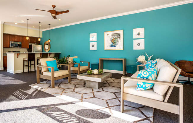 A living room with a white couch and a rug with the word