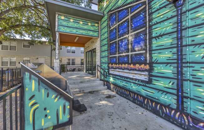 the entrance to a building with a blue and green painted wall  at Sunset Ridge, San Antonio, Texas