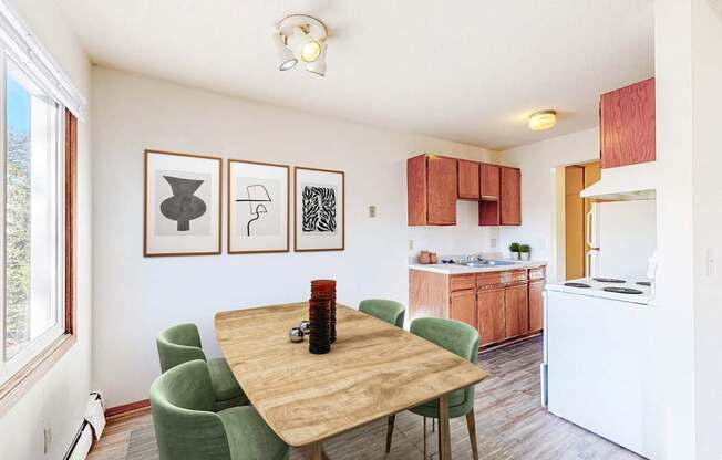 a dining room table with a kitchen in the background