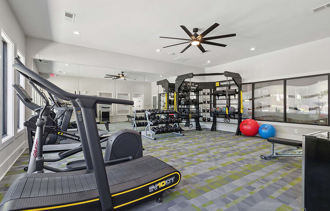 Community Fitness Center with Equipment at Retreat at Stonecrest Apartments located in Lithonia, GA.