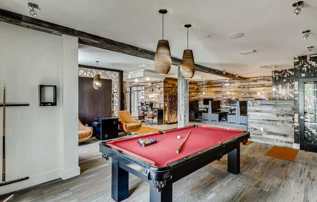 Resident clubhouse with pool table and gaming area at EOS in Orlando, FL