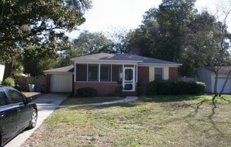 Cute  2 bedroom 1 bath Brick Bungalow with 1 car detached garage.