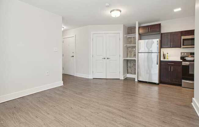 a kitchen and living room in a two bedroom apartment