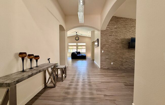 Welcome to this stunning 5-bedroom, 3-bath home located in the desirable Estates of Wigwam Ranch community!