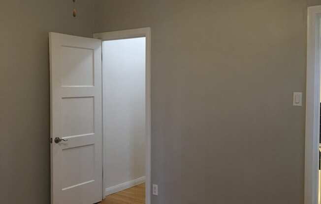 Empty bedroom with hardwood floors