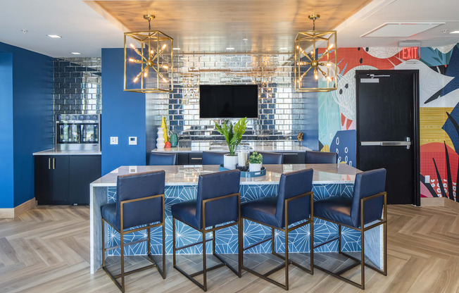 Upstairs lounge in Pixon with wine fridge, seating island and tv at Lake Nona Pixon, Orlando