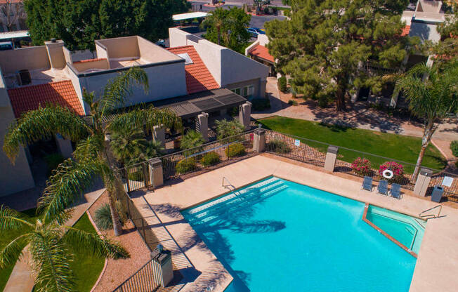 Aerial view of pool and green space surrounding pool area