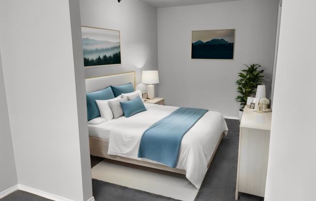 a bedroom with a white bed and blue pillows