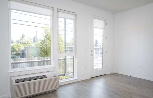 The Lenox | Living Room Area with Large Windows