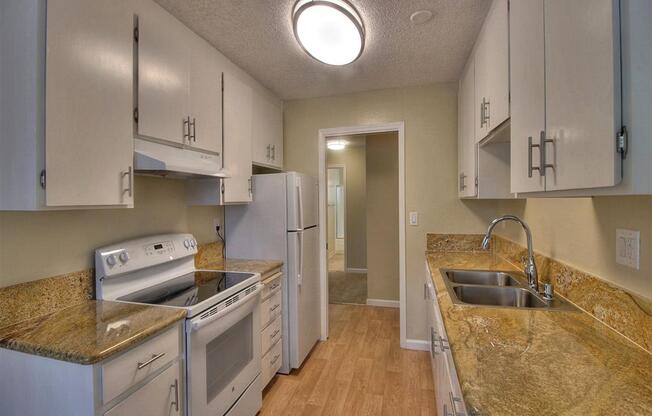 Fully Equipped Kitchen Includes Frost-Free Refrigerator, Electric Range, & Dishwasher at Balboa Apartments, Sunnyvale, 94086