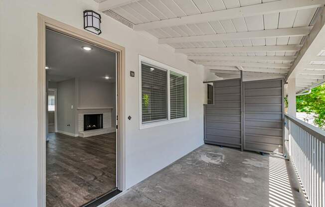 A room with a fireplace and a sliding door.