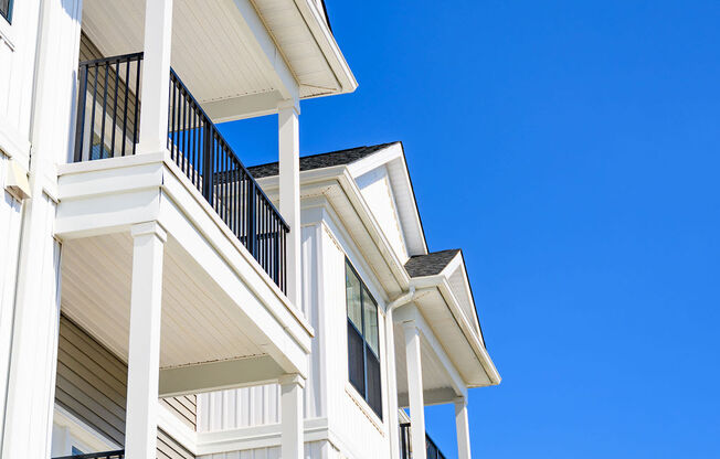 A white building with balconies and railings at Madison Prickett Preserve, Yardley Pennsylvania